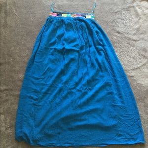 Royal blue long skirt w/ design at the waist line.